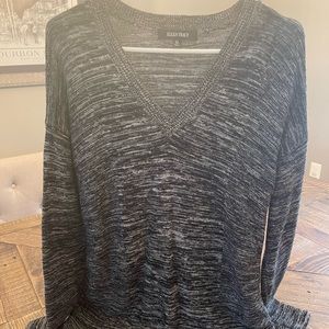 He’s there’s black sweater